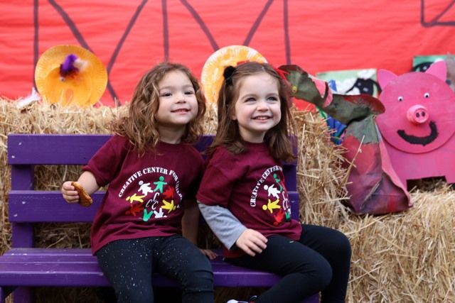 Two children at the fall pumpkin patch celebration