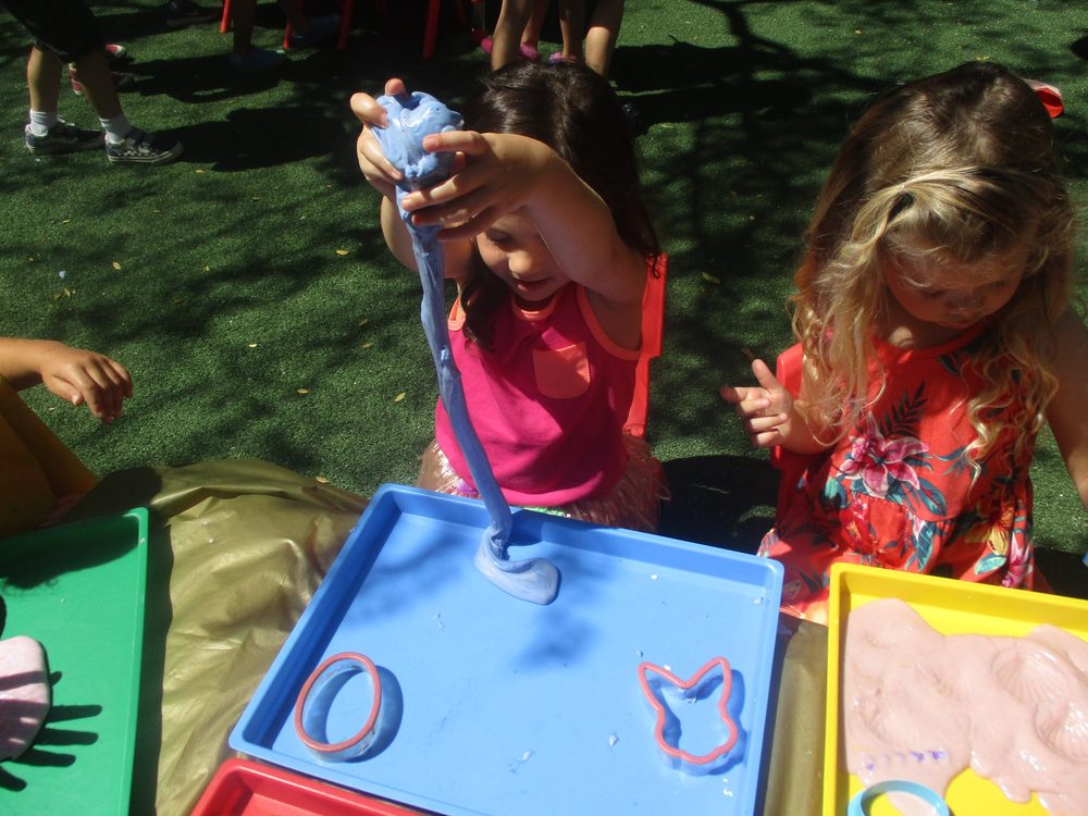 Children enjoying outdoor water play during summer camp